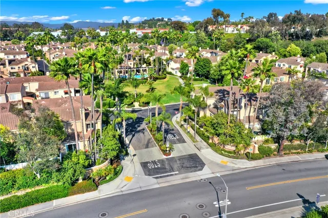 a view of a street with a flower garden