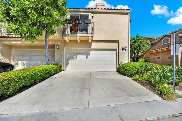 a view of a patio with table and chairs and potted plants