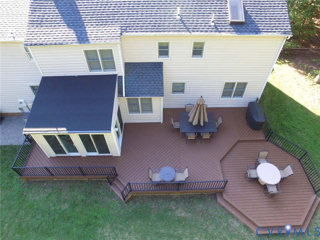 2611 Olde Stone Road Midlothian, VA 23113 - Photo 2 of 2 a backyard of a house with wooden floor and outdoor seating