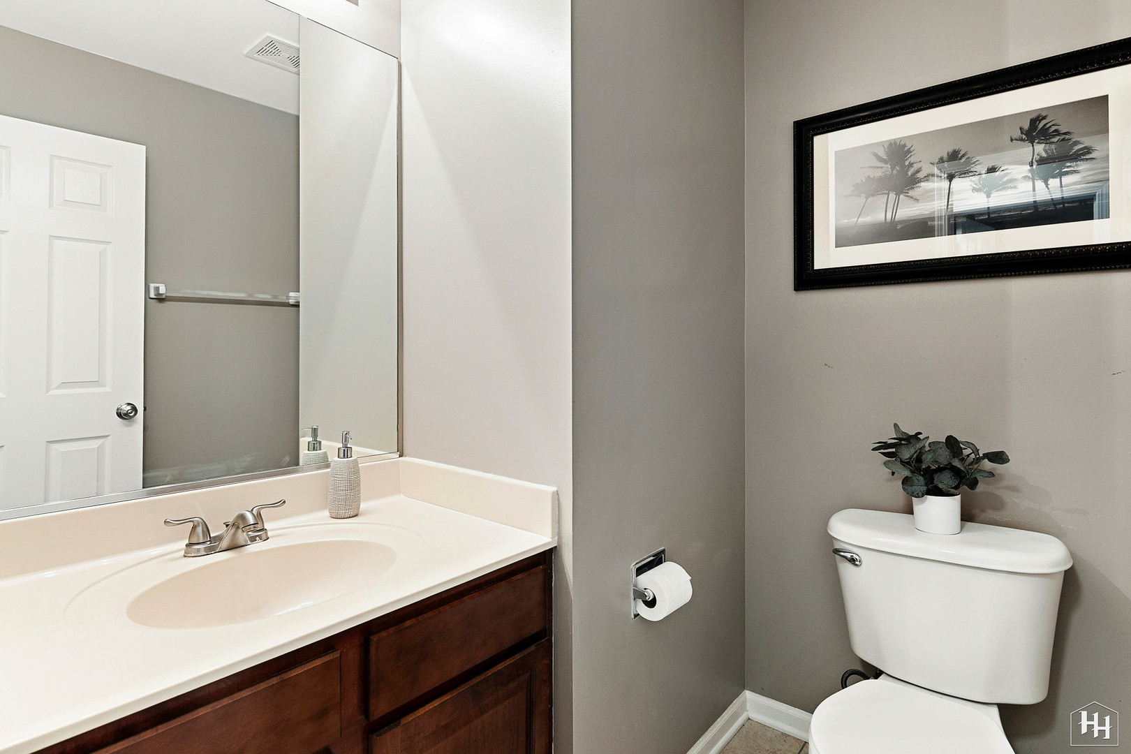 1389 Collins Drive Cary, IL 60013 - Photo 17 of 39 a bathroom with a toilet sink and mirror