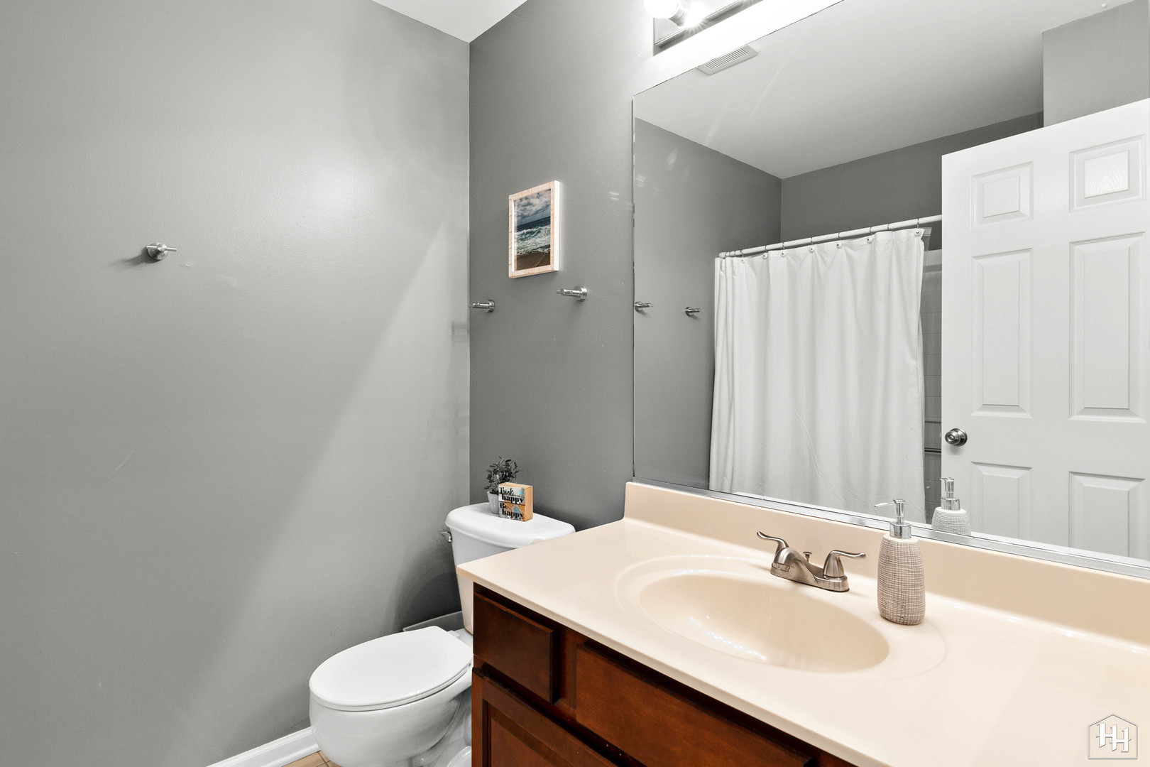 1389 Collins Drive Cary, IL 60013 - Photo 27 of 39 a bathroom with a sink toilet and shower