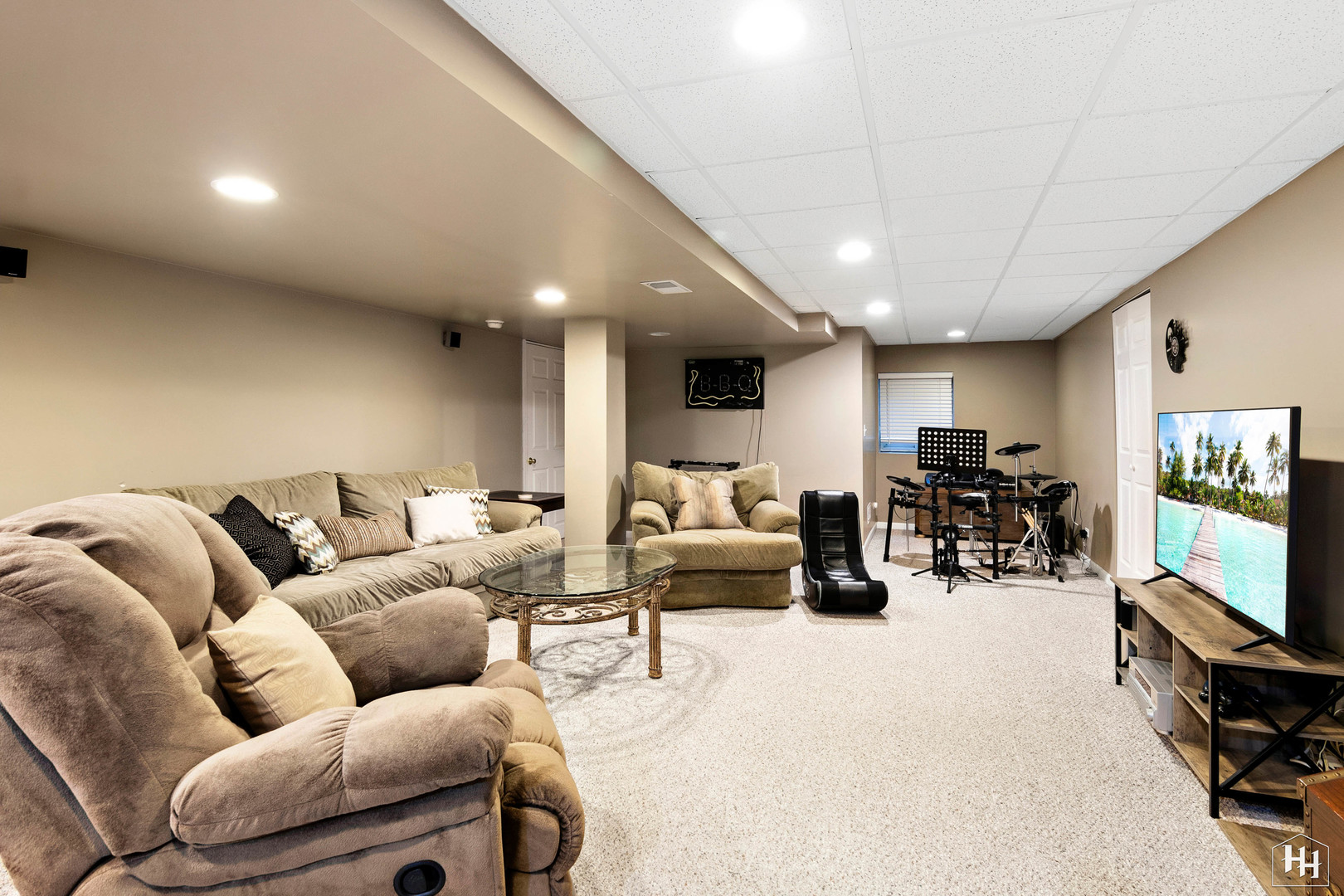 1389 Collins Drive Cary, IL 60013 - Photo 29 of 39 a living room with furniture and a flat screen tv