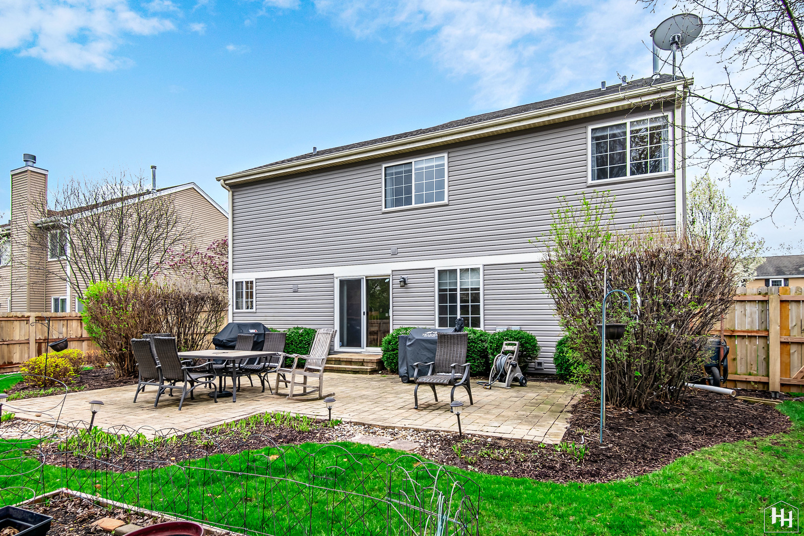 1389 Collins Drive Cary, IL 60013 - Photo 33 of 39 a view of a house with patio and a yard