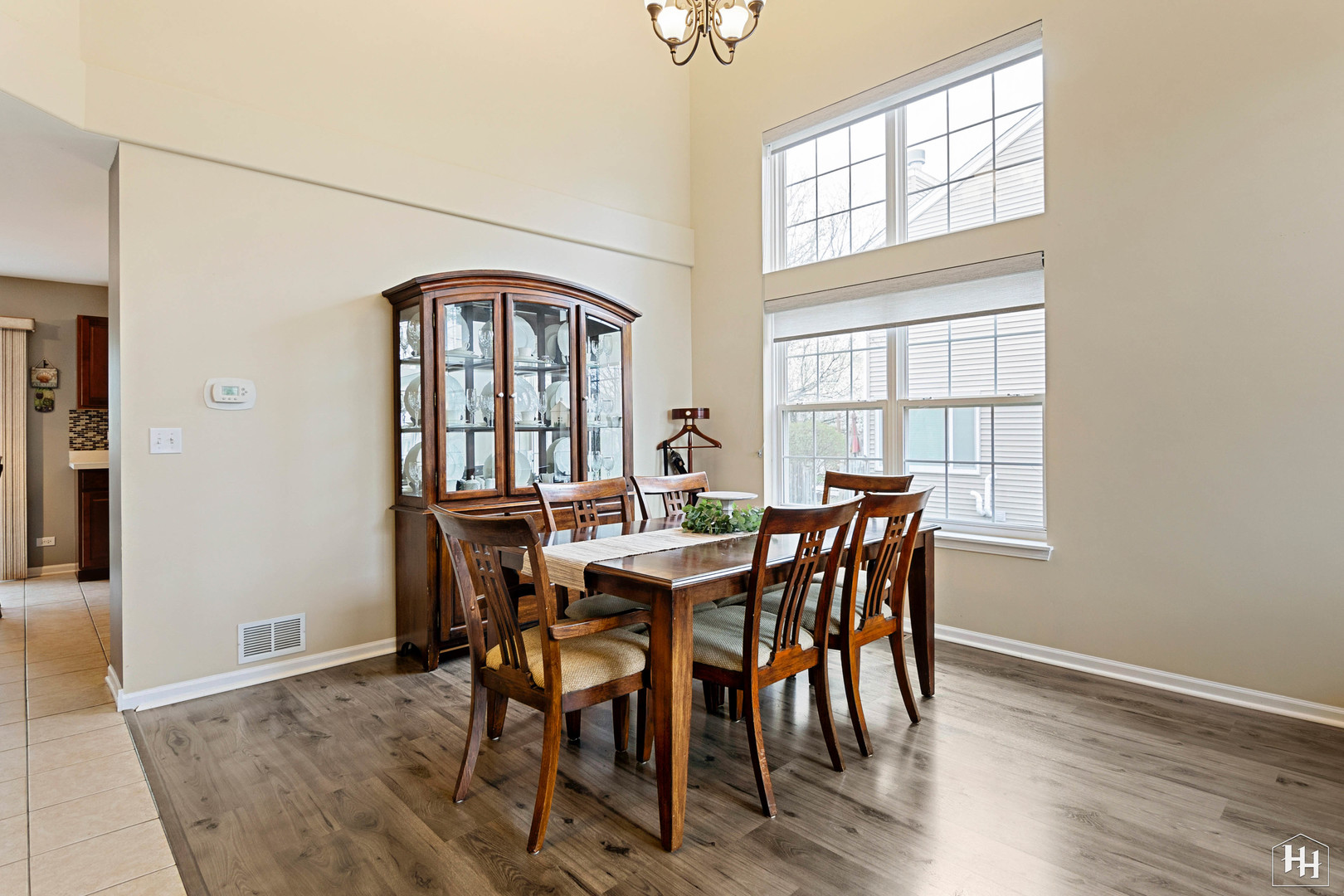 1389 Collins Drive Cary, IL 60013 - Photo 8 of 39 a view of a dining room with furniture window and wooden floor