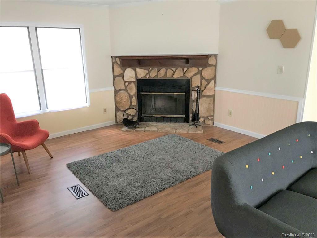 7 Pink Fox Ridge Road Weaverville, NC 28787 - Photo 5 of 12 a living room with furniture and a fireplace