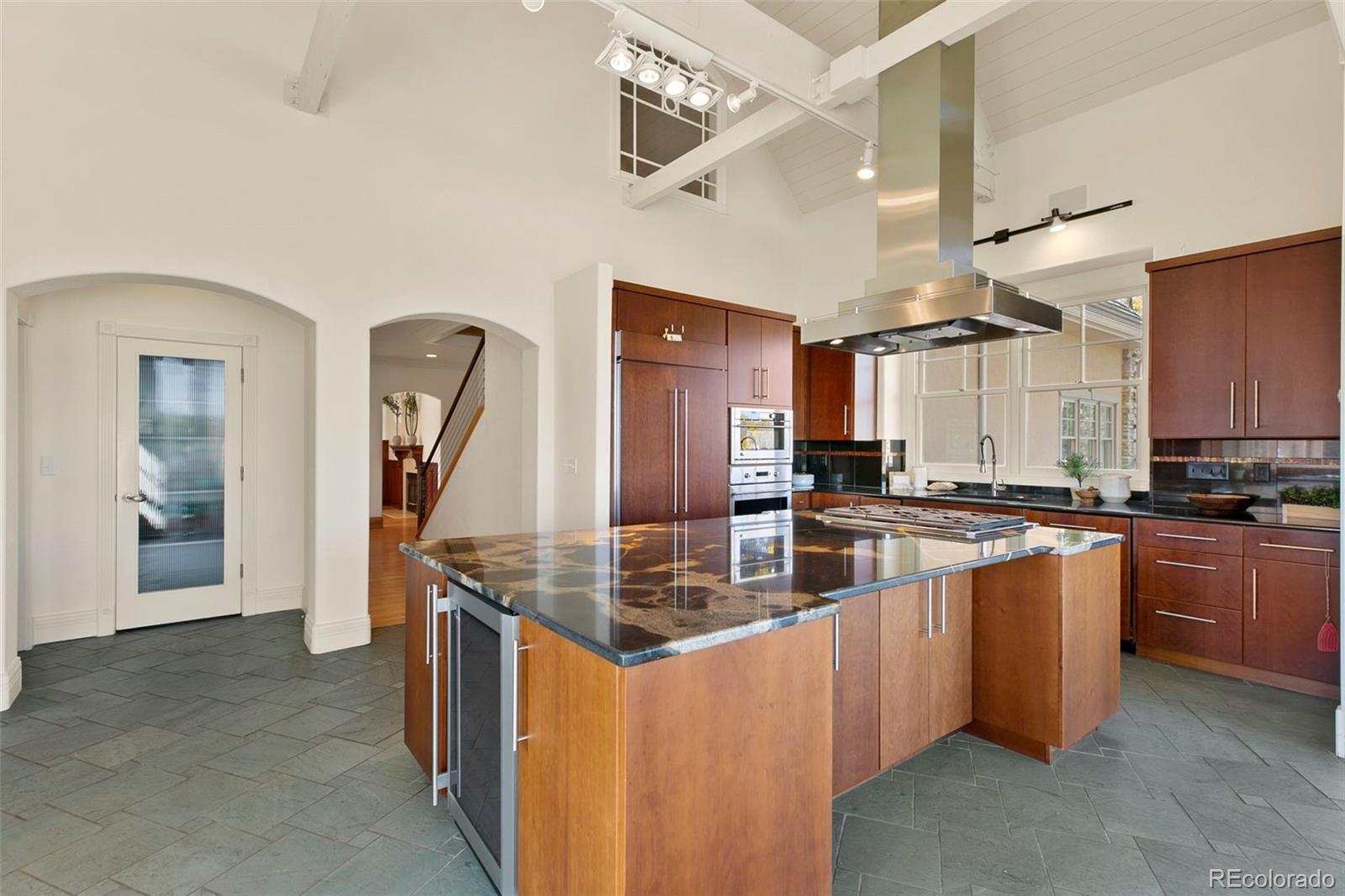 2400 Terry Lake Road Fort Collins, CO 80524 - Photo 11 of 44 a kitchen with stainless steel appliances granite countertop a sink and a refrigerator