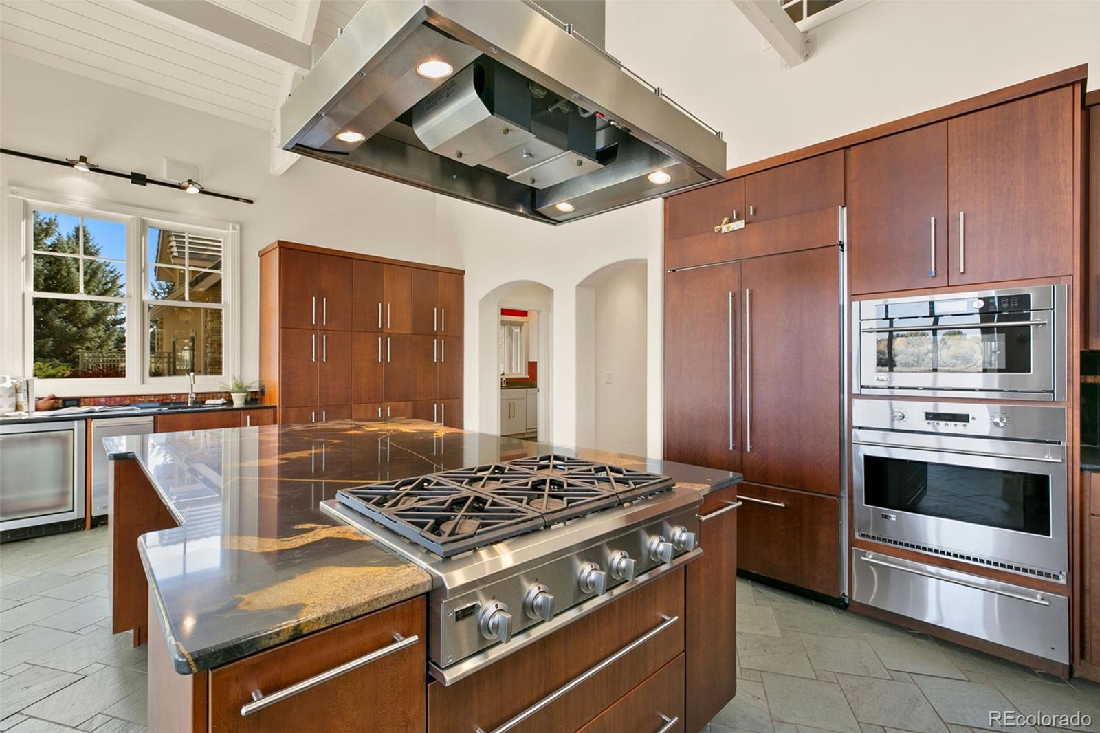 2400 Terry Lake Road Fort Collins, CO 80524 - Photo 12 of 44 a kitchen with stainless steel appliances granite countertop a stove and a refrigerator