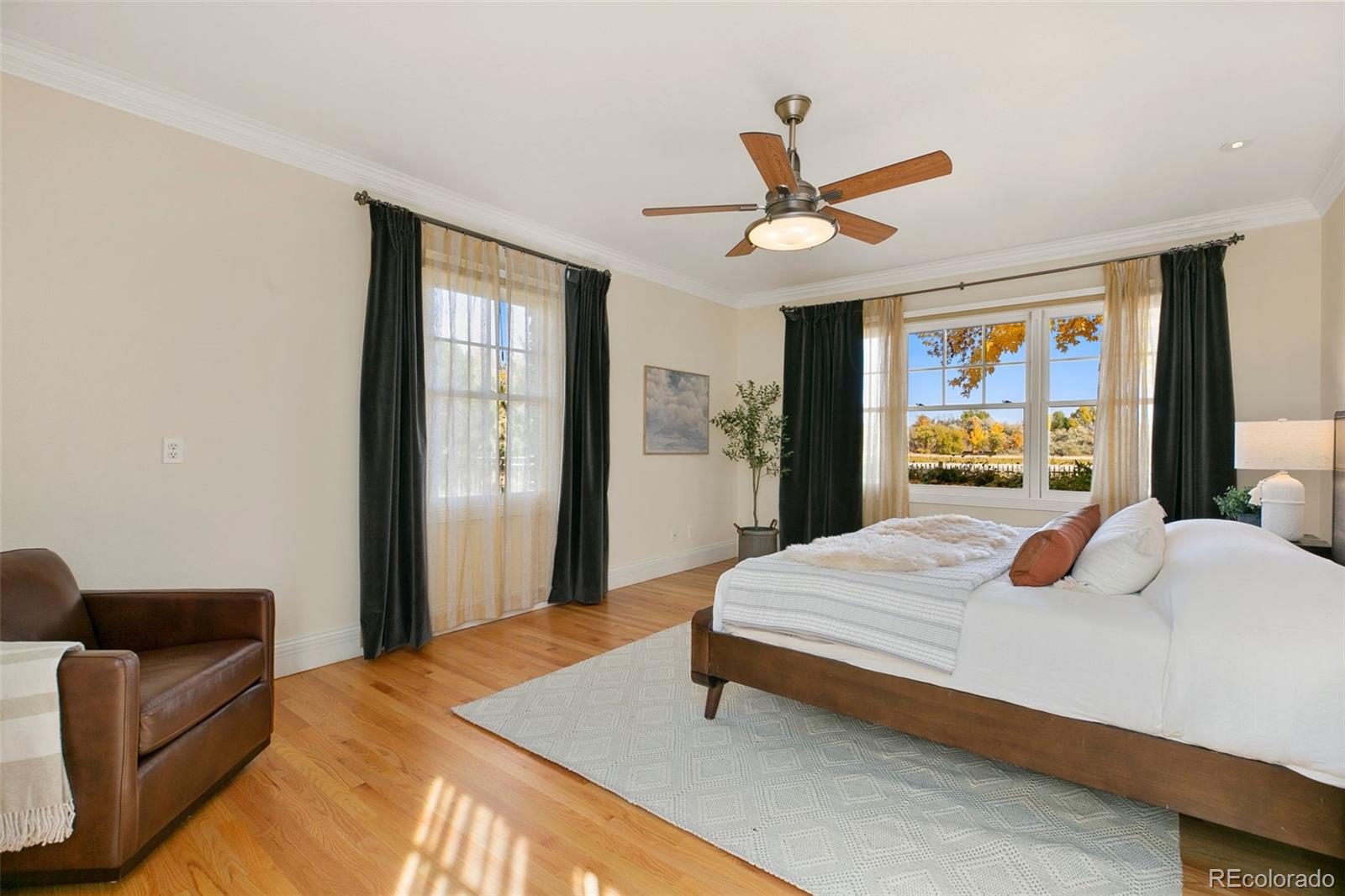 2400 Terry Lake Road Fort Collins, CO 80524 - Photo 16 of 44 a bedroom with a bed and a large mirror