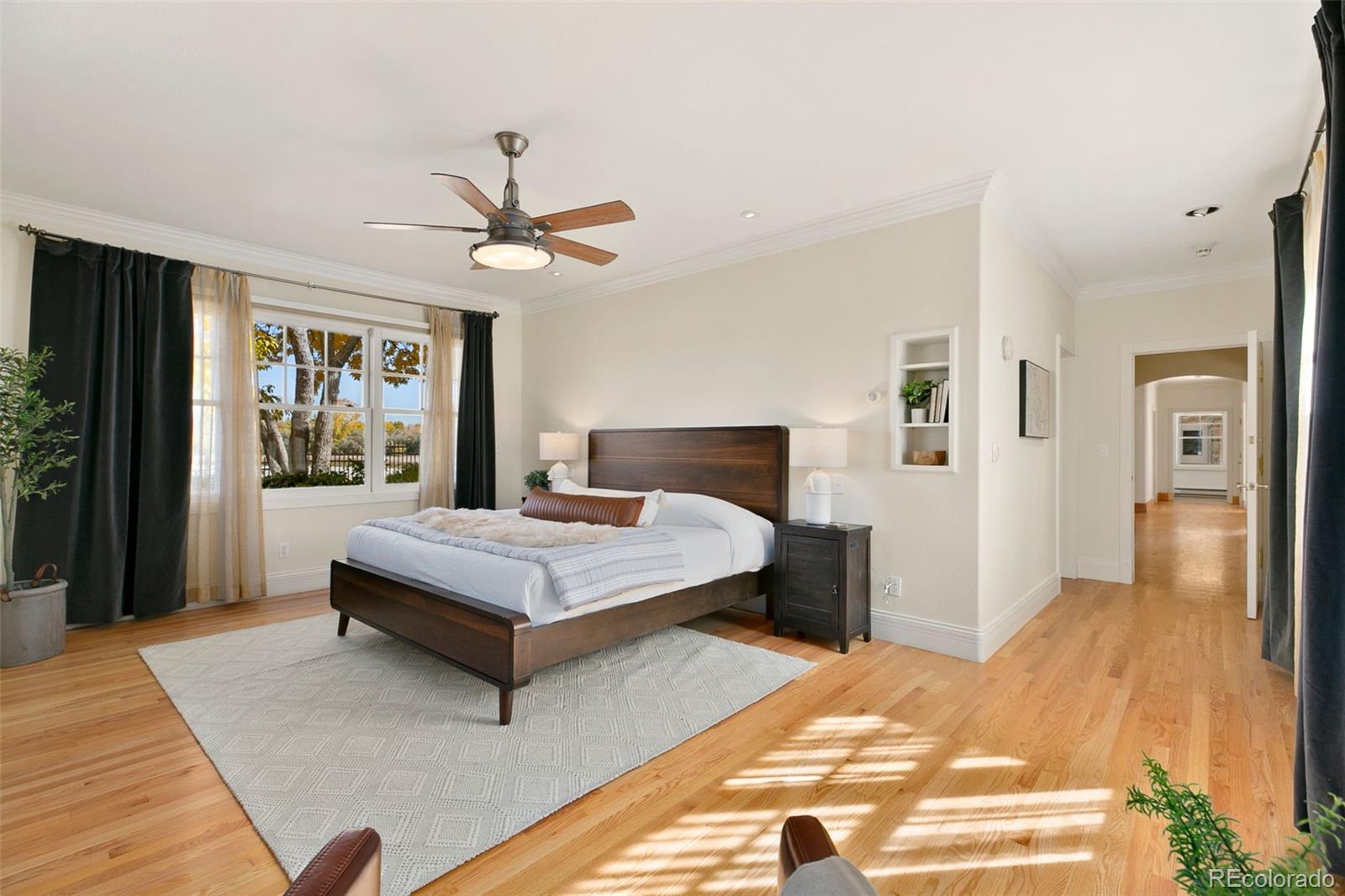 2400 Terry Lake Road Fort Collins, CO 80524 - Photo 17 of 44 a bedroom with a bed and a chandelier