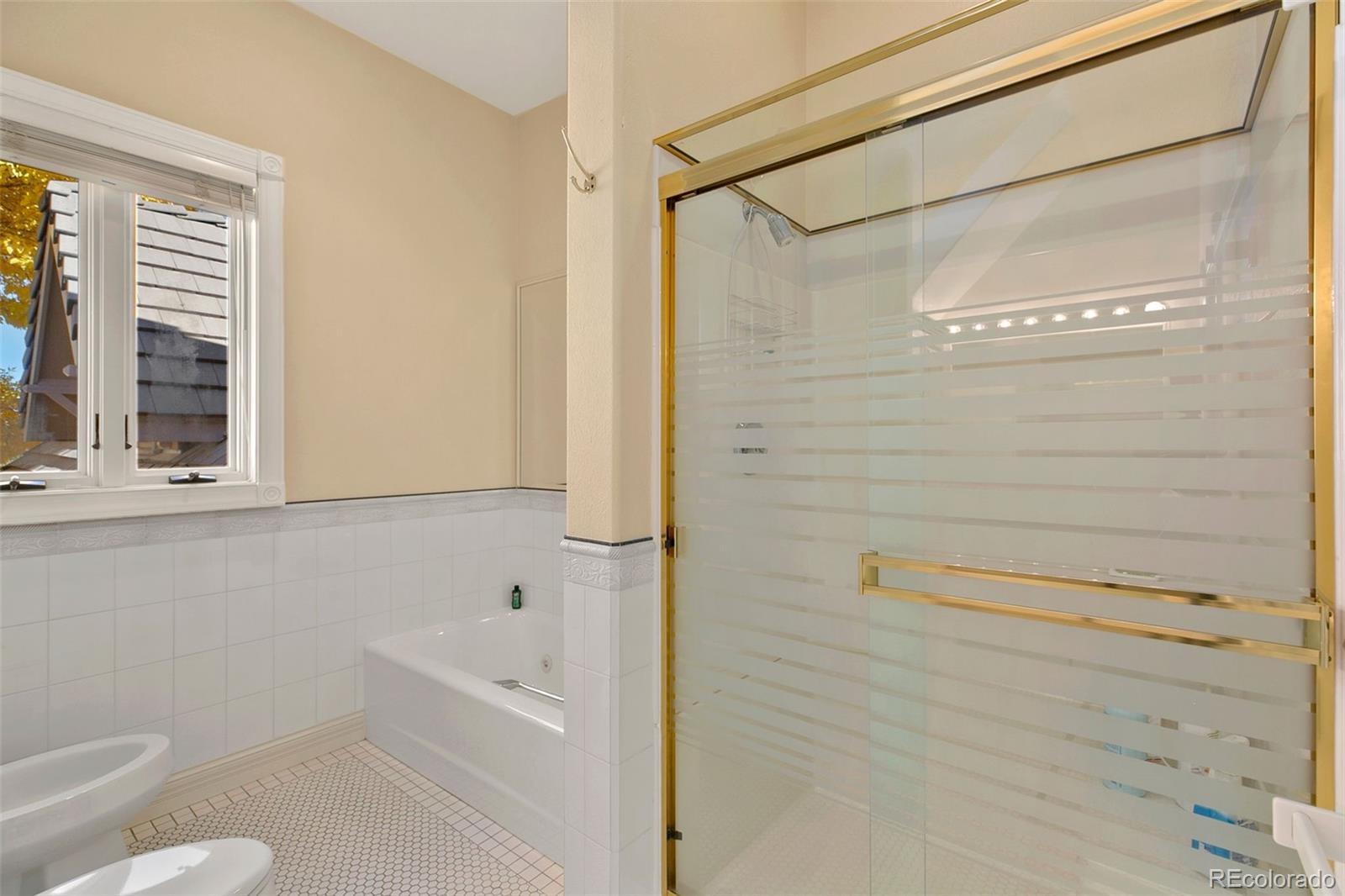 2400 Terry Lake Road Fort Collins, CO 80524 - Photo 23 of 44 a bathroom with a shower and a toilet