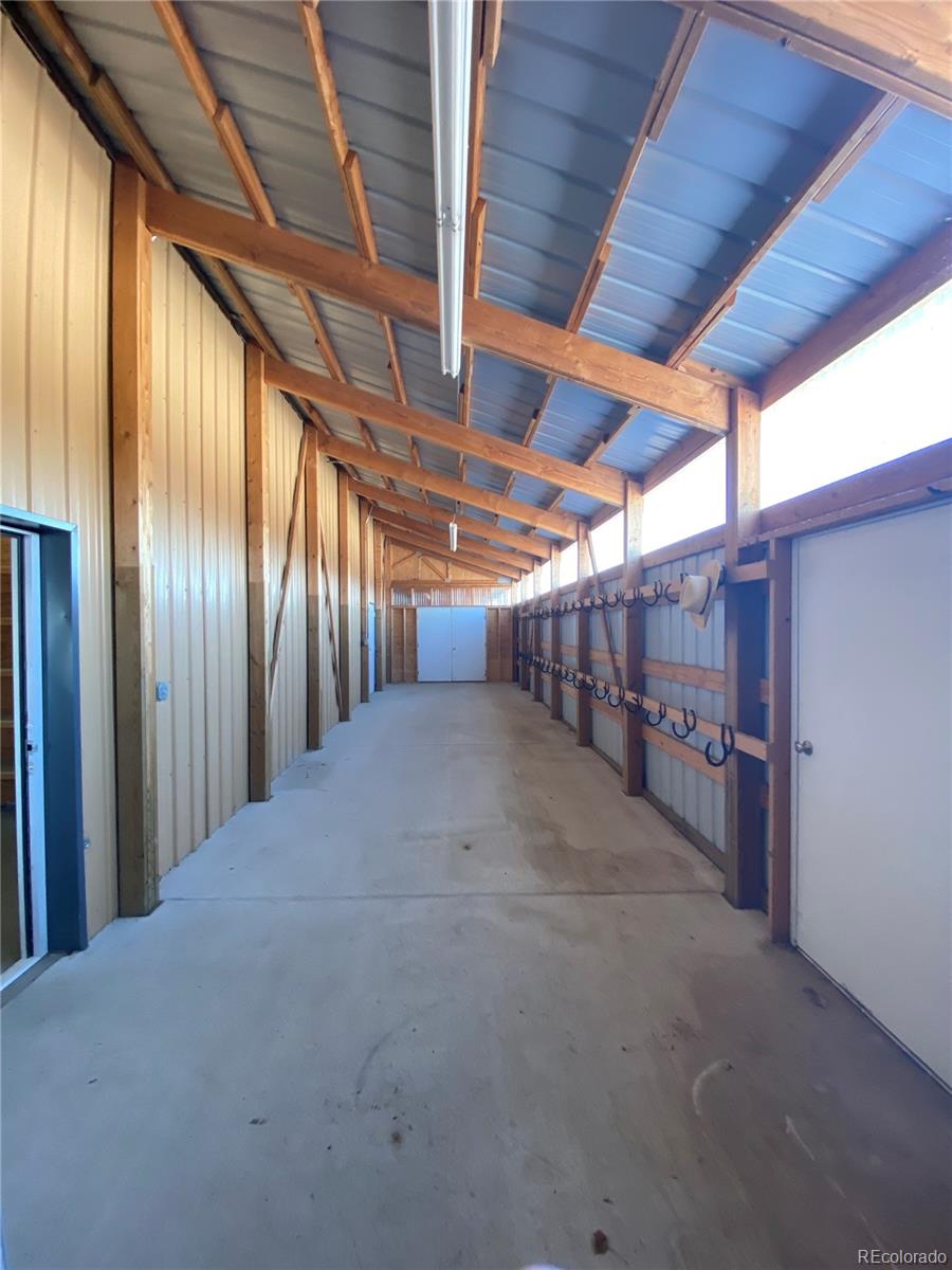 2400 Terry Lake Road Fort Collins, CO 80524 - Photo 29 of 44 a view of empty room with wooden ceiling
