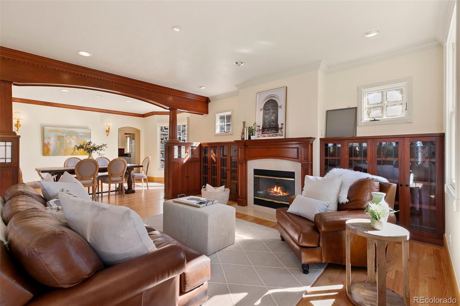 2400 Terry Lake Road Fort Collins, CO 80524 - Photo 4 of 44 a living room with furniture a fireplace and a window