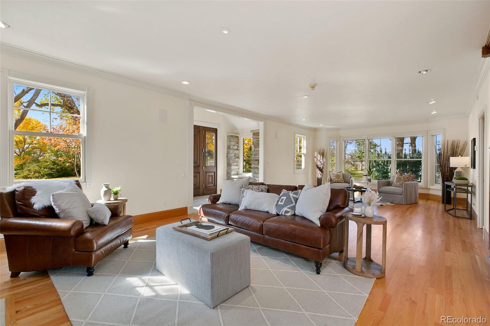2400 Terry Lake Road Fort Collins, CO 80524 - Photo 5 of 44 a living room with furniture and a wooden floor