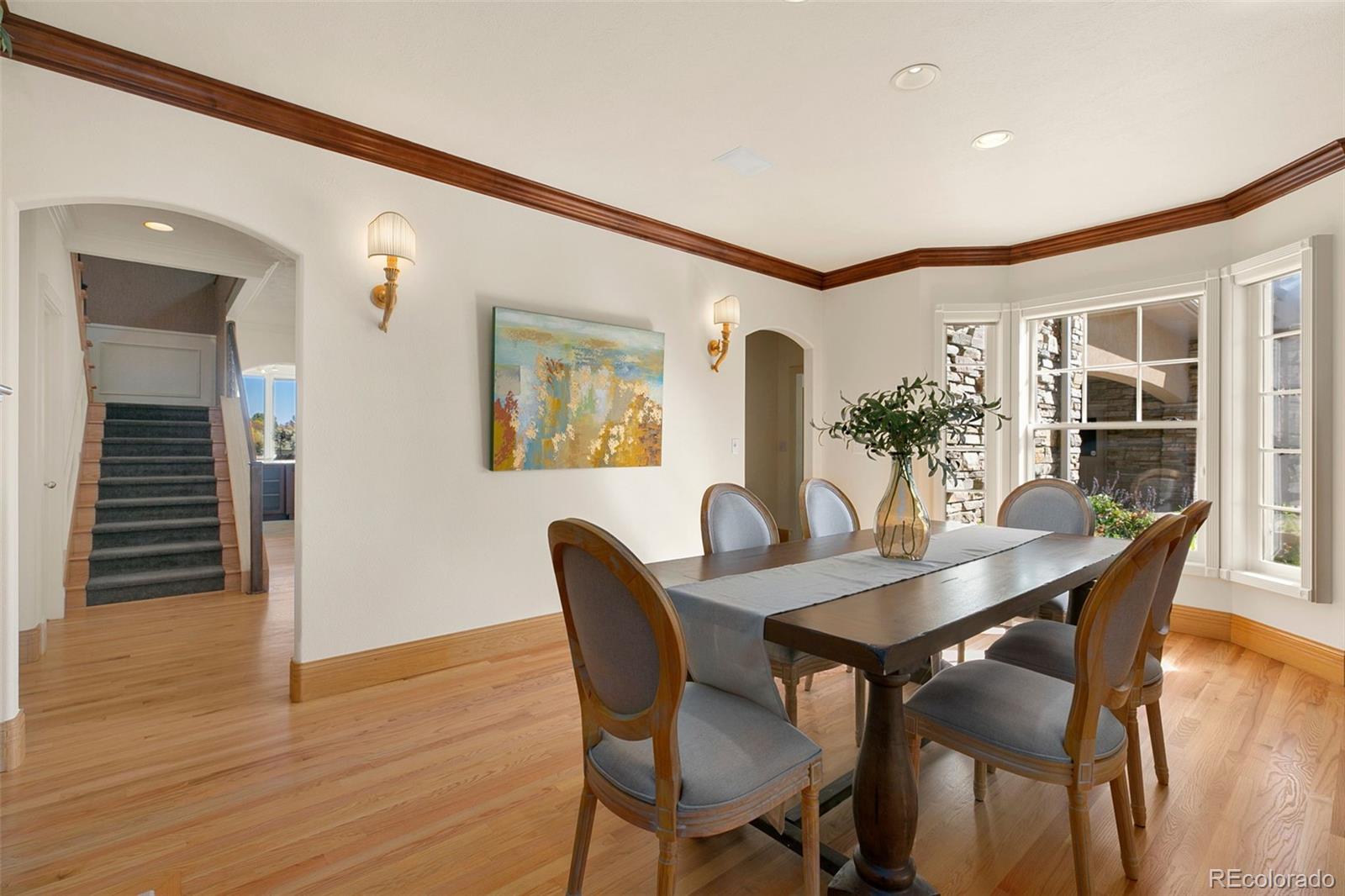 2400 Terry Lake Road Fort Collins, CO 80524 - Photo 6 of 44 a view of a dining room with furniture and wooden floor