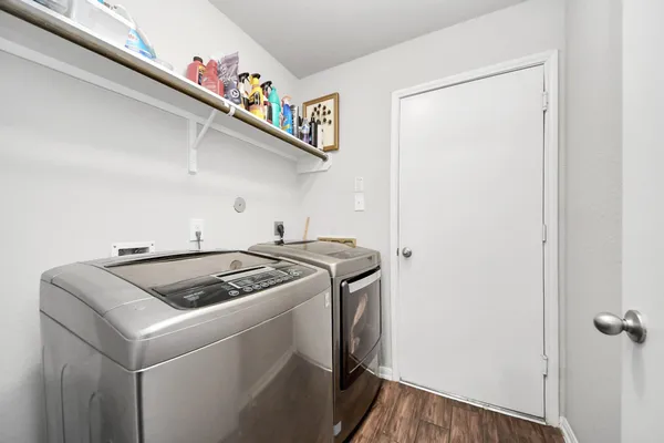 a kitchen with granite countertop stainless steel appliances and wooden cabinets