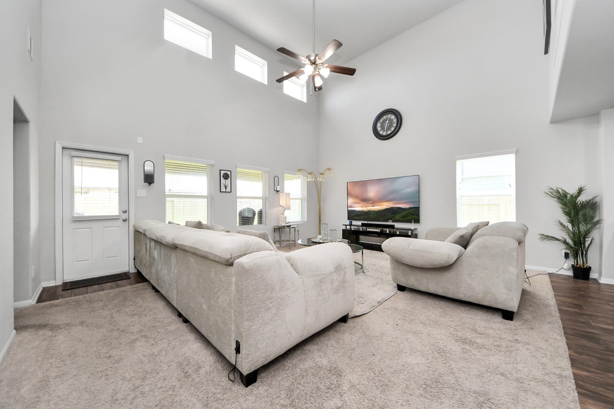 2643 Ridgeback Drive Rosenberg, TX 77471 - Photo 20 of 46 Stunning two-story living room with soaring ceilings and abundant natural light.
