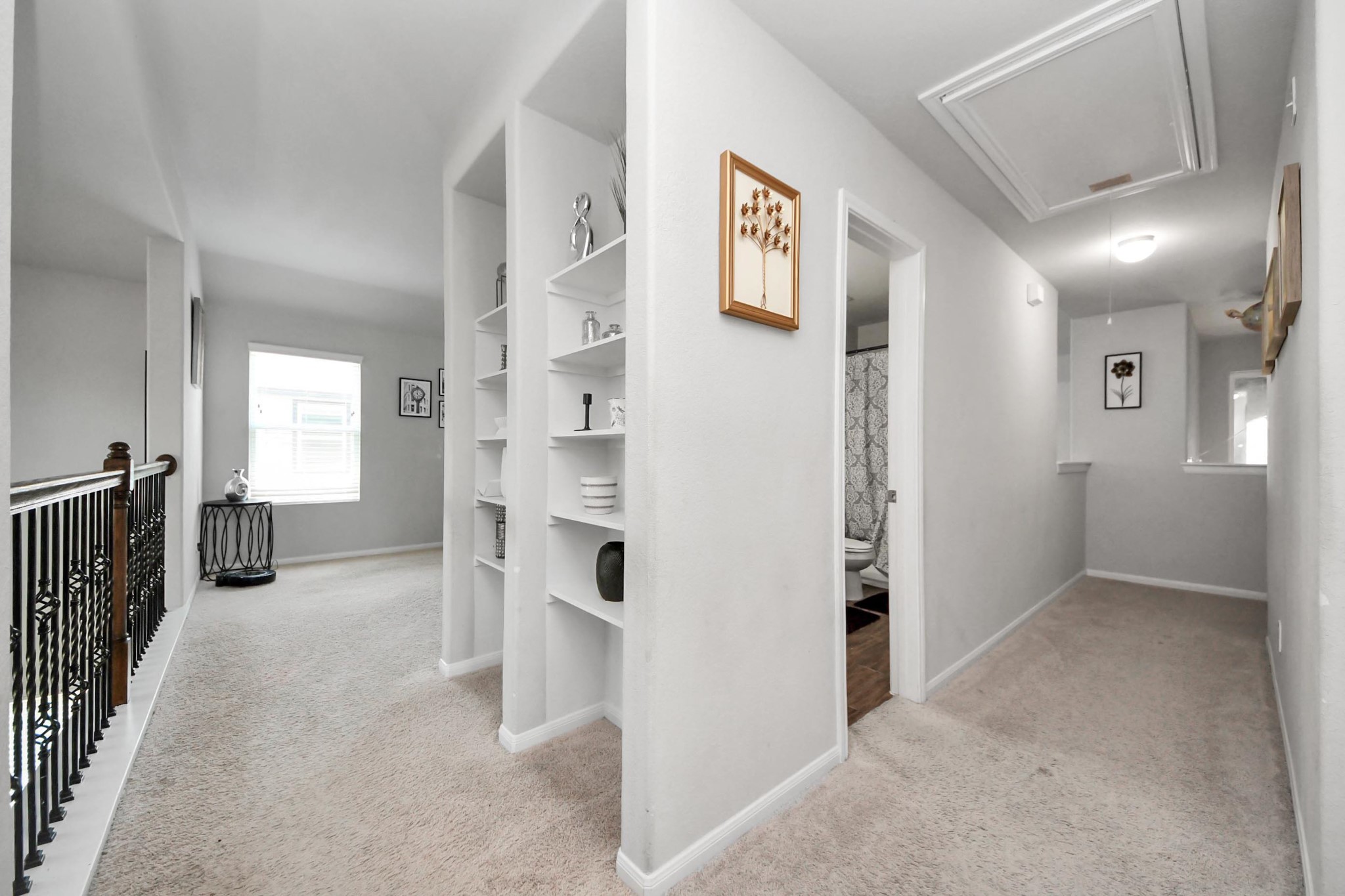 2643 Ridgeback Drive Rosenberg, TX 77471 - Photo 33 of 46 Hallway with built-in shelving and multiple access points to bedrooms and bath.