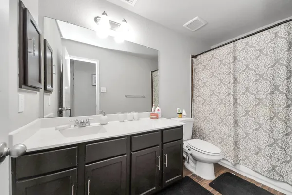 an empty room with a empty space and windows