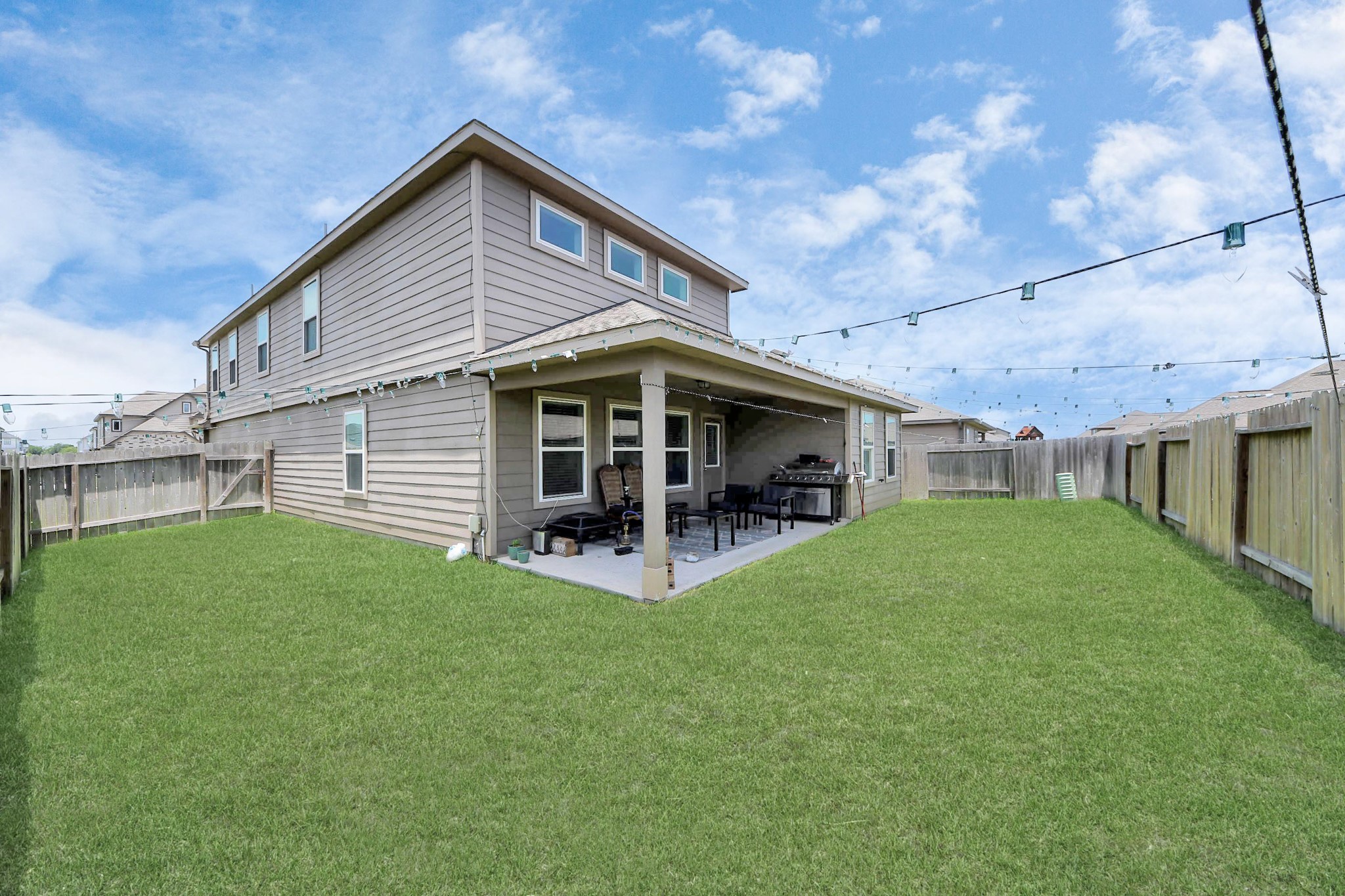 2643 Ridgeback Drive Rosenberg, TX 77471 - Photo 39 of 46 Large fully fenced backyard with extended patio and lush lawn.