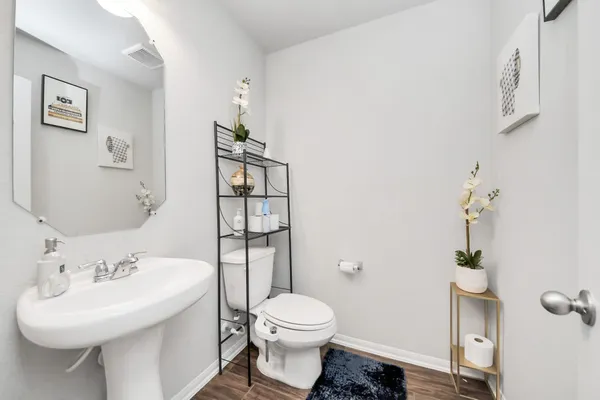 a living room with furniture a rug and a fireplace
