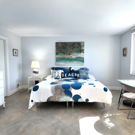 a bed room with bed and a window