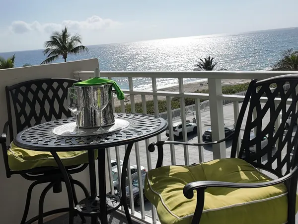 a view of a balcony dining area