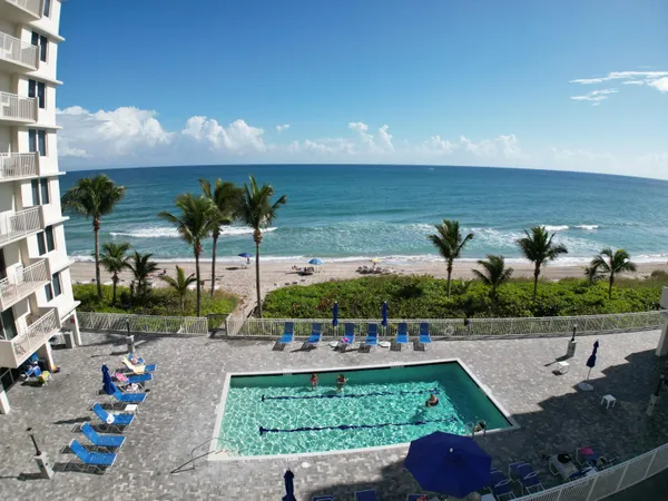 a view of a swimming pool with a patio