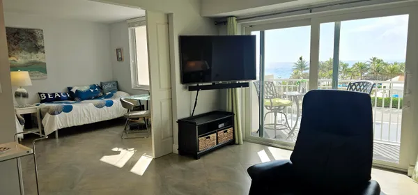 a living room with furniture and a flat screen tv