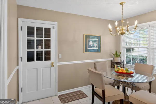 a view of a dining room with furniture window and outside view