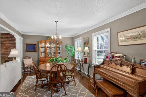 a view of a dining room with furniture window and outside view