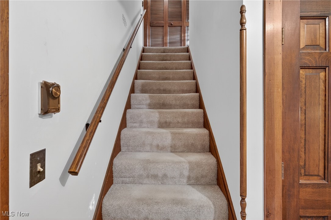 25700 Winona Road Homeworth, OH 44634 - Photo 17 of 49 Stairway with carpet flooring