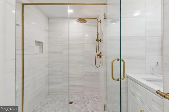 a bathroom with a shower and a sink