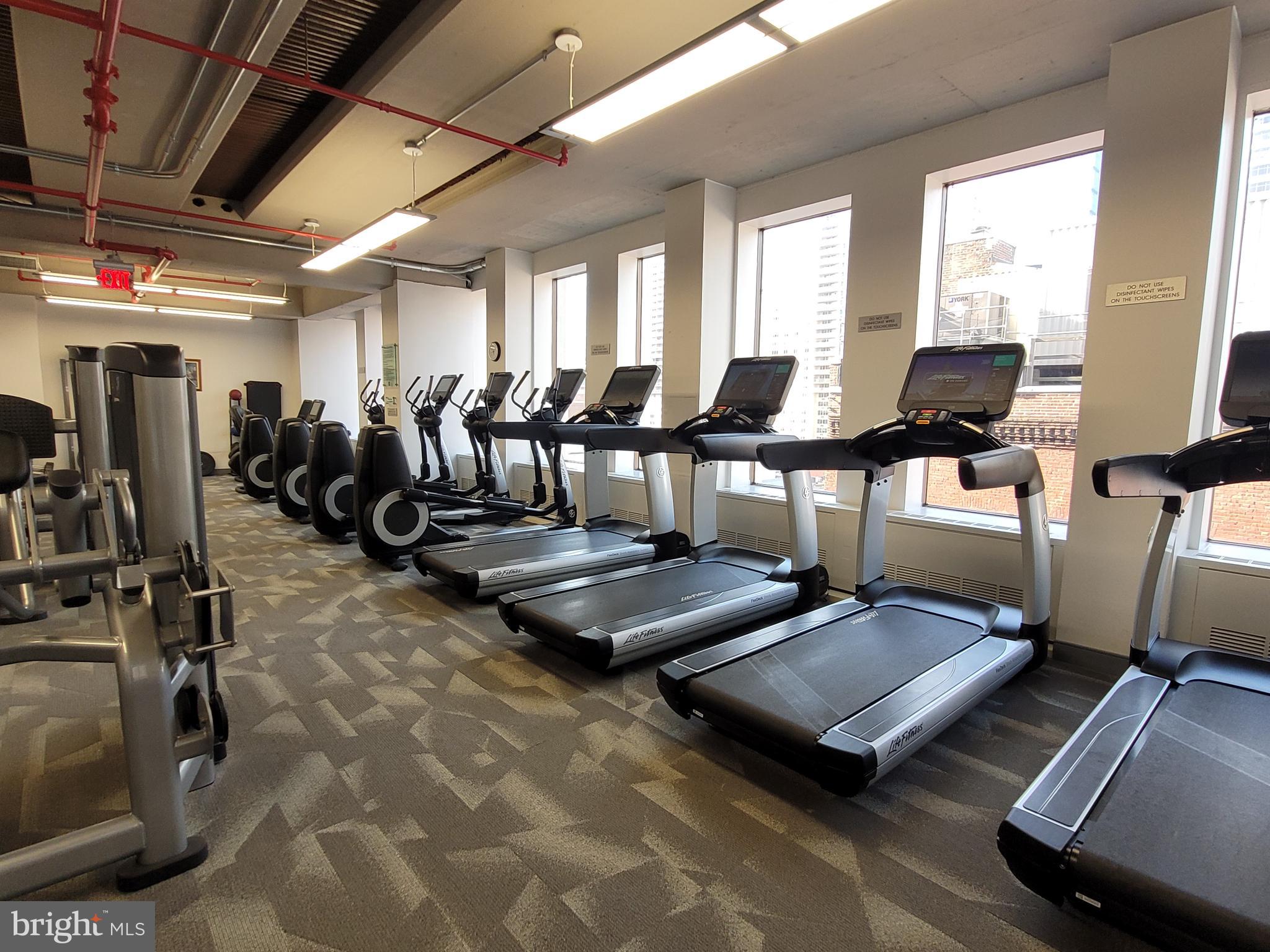 135 South 19th Street, Unit 403 Philadelphia, PA 19103 - Photo 19 of 19 a living room with gym equipment