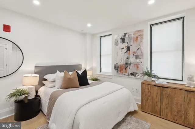 a bedroom with a bed and a window