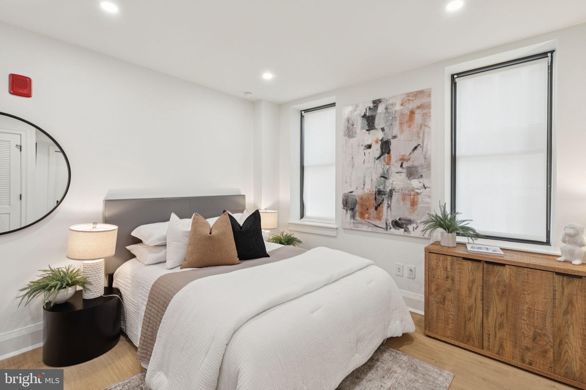 135 South 19th Street, Unit 403 Philadelphia, PA 19103 - Photo 2 of 19 a bedroom with a bed and a window