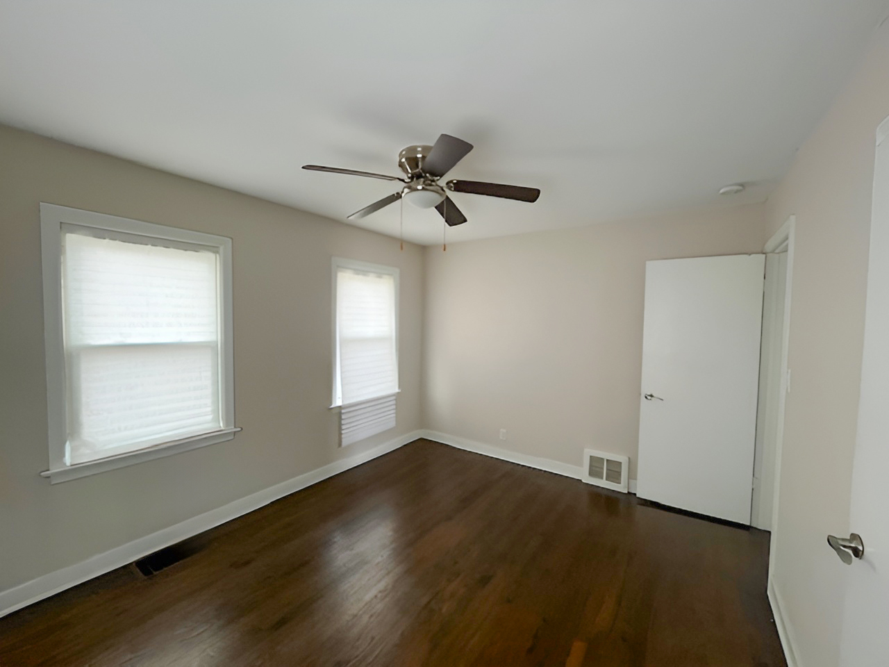 17943 Ridgewood Avenue Lansing, IL 60438 - Photo 6 of 12 wooden floor in an empty room with a window