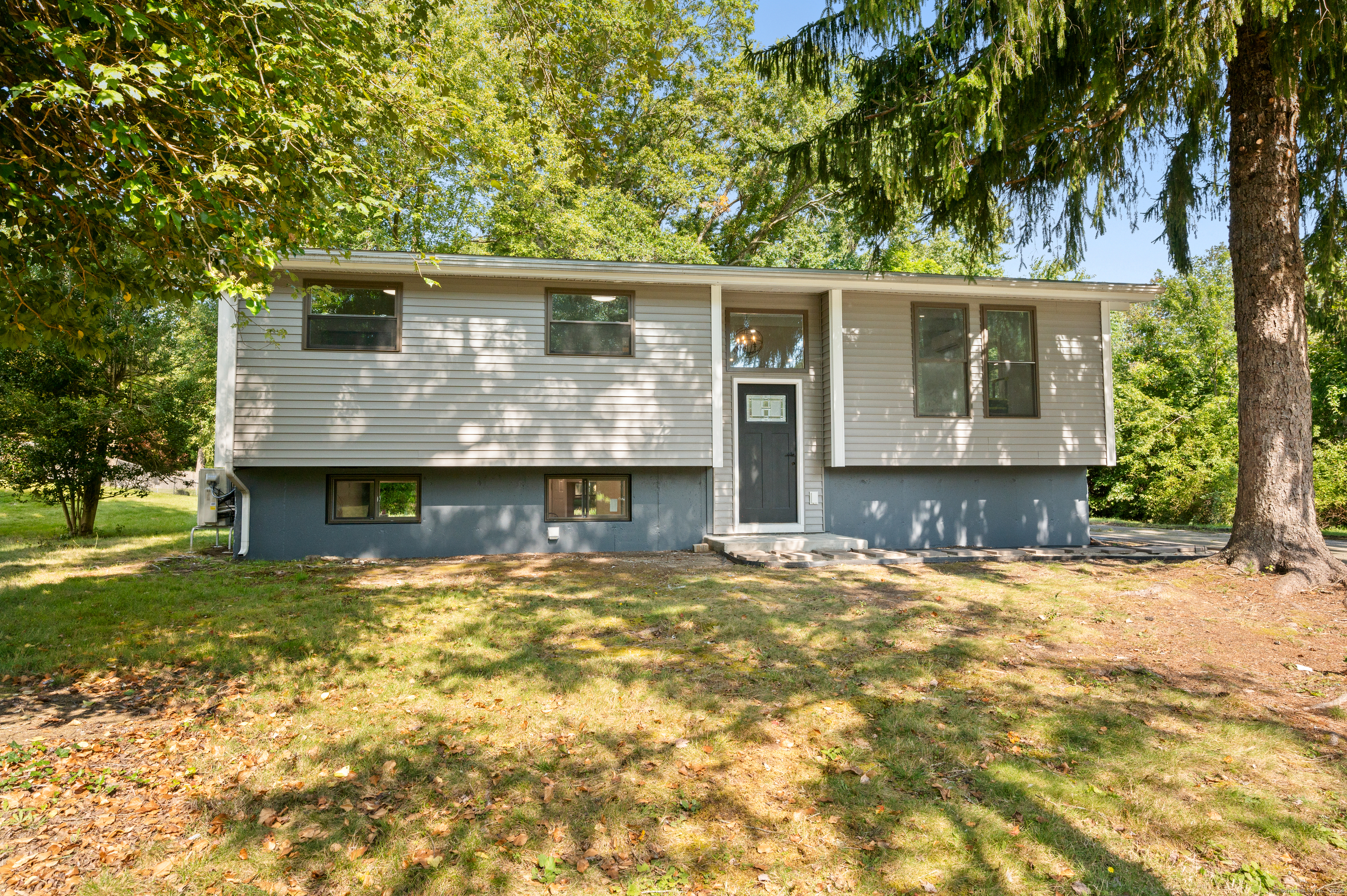 front view of a house with a yard