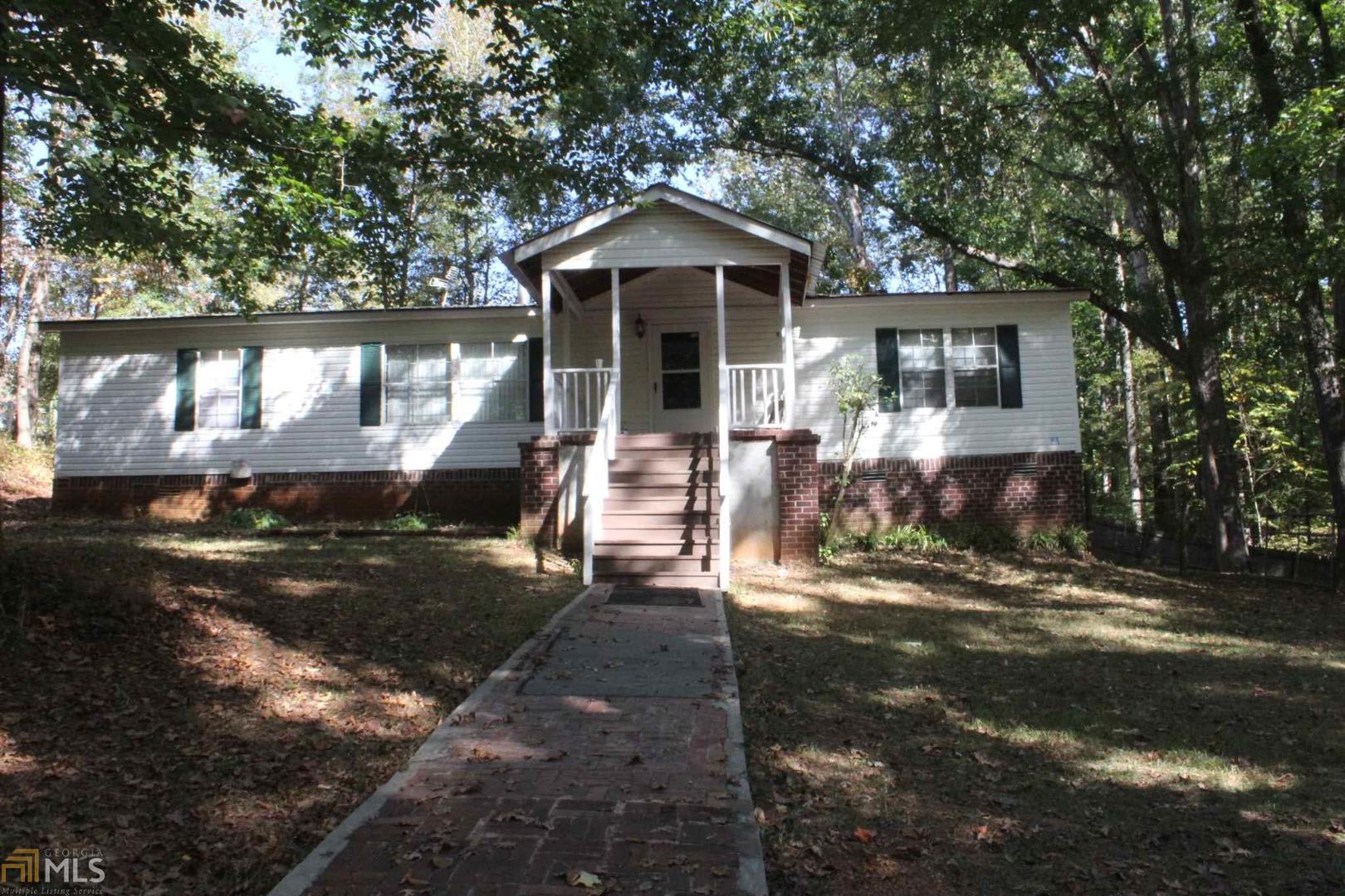 459 Antioch Church Road Nicholson, GA 30565 - Photo 1 of 1 a front view of a house with garden