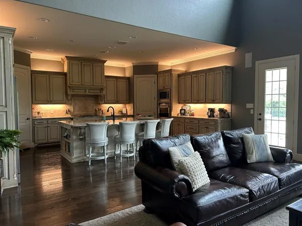 a outdoor living space with furniture kitchen view and a large window