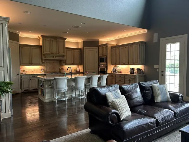 a outdoor living space with furniture kitchen view and a large window