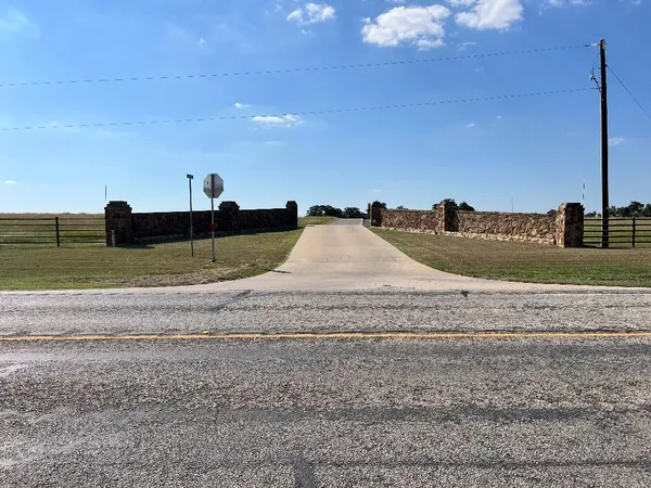 a view of a dry yard with a slide