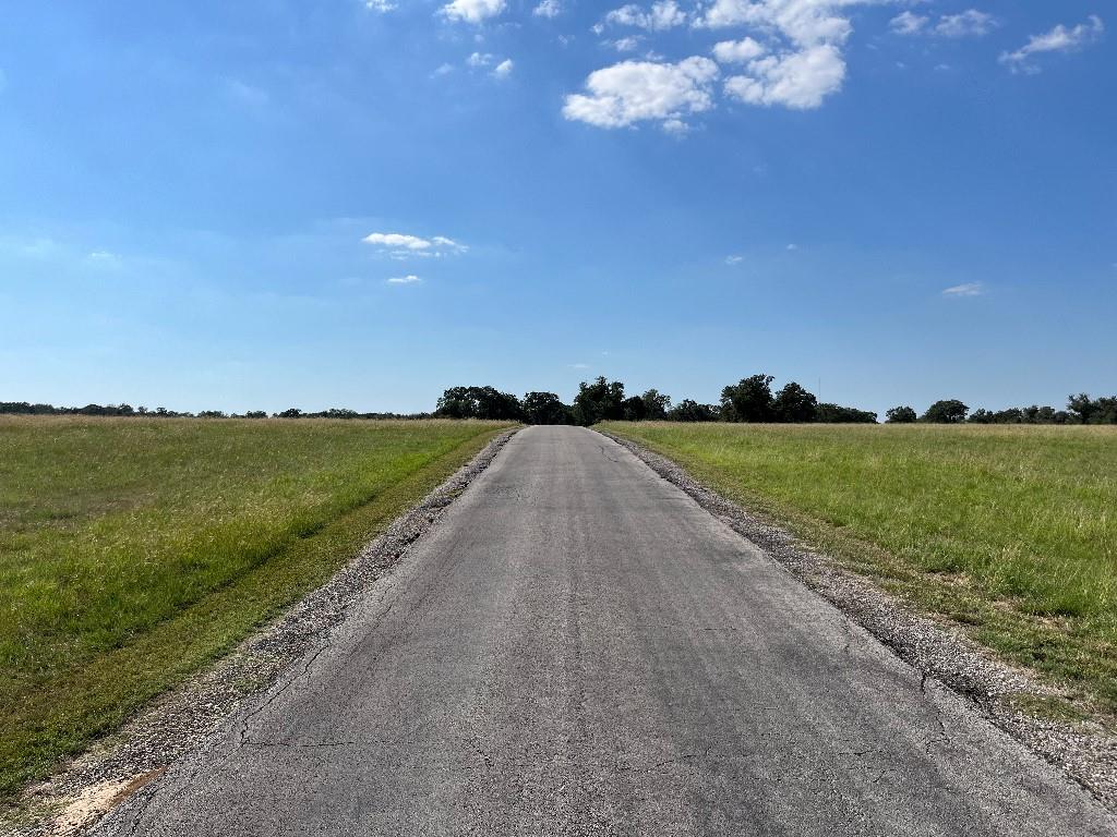 470 Granite Way Jacksboro, TX 76458 - Photo 20 of 20 a view of a lake with a big yard