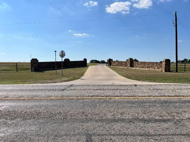 a view of a dry yard with a slide