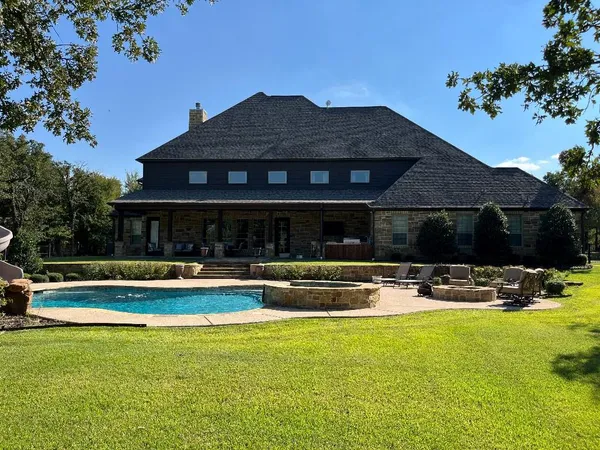 a front view of house with yard and outdoor seating