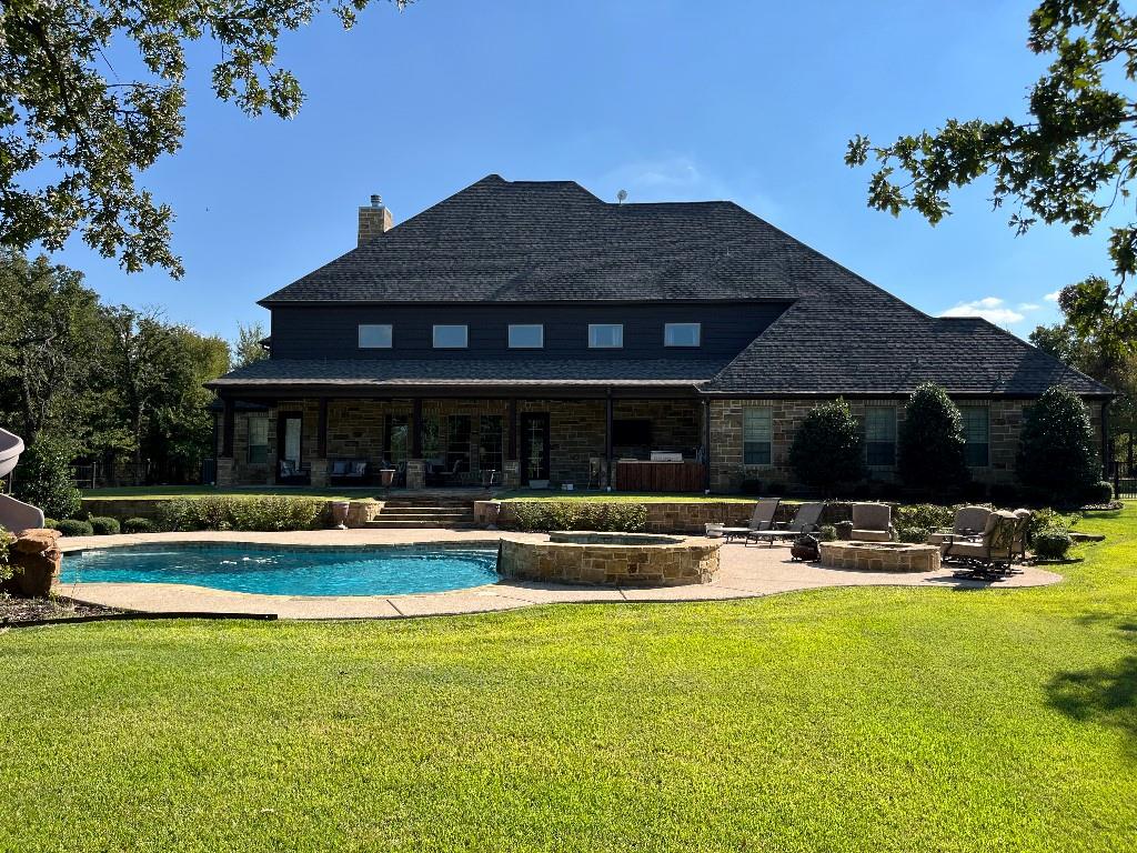 470 Granite Way Jacksboro, TX 76458 - Photo 3 of 22 a front view of house with yard and outdoor seating