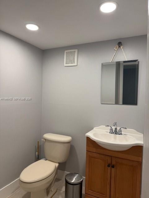 16300 Golf Club Road, Unit 208 Weston, FL 33326 - Photo 20 of 25 a bathroom with a toilet sink and mirror