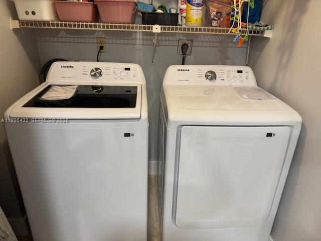 16300 Golf Club Road, Unit 208 Weston, FL 33326 - Photo 21 of 25 a utility room with dryer and washer