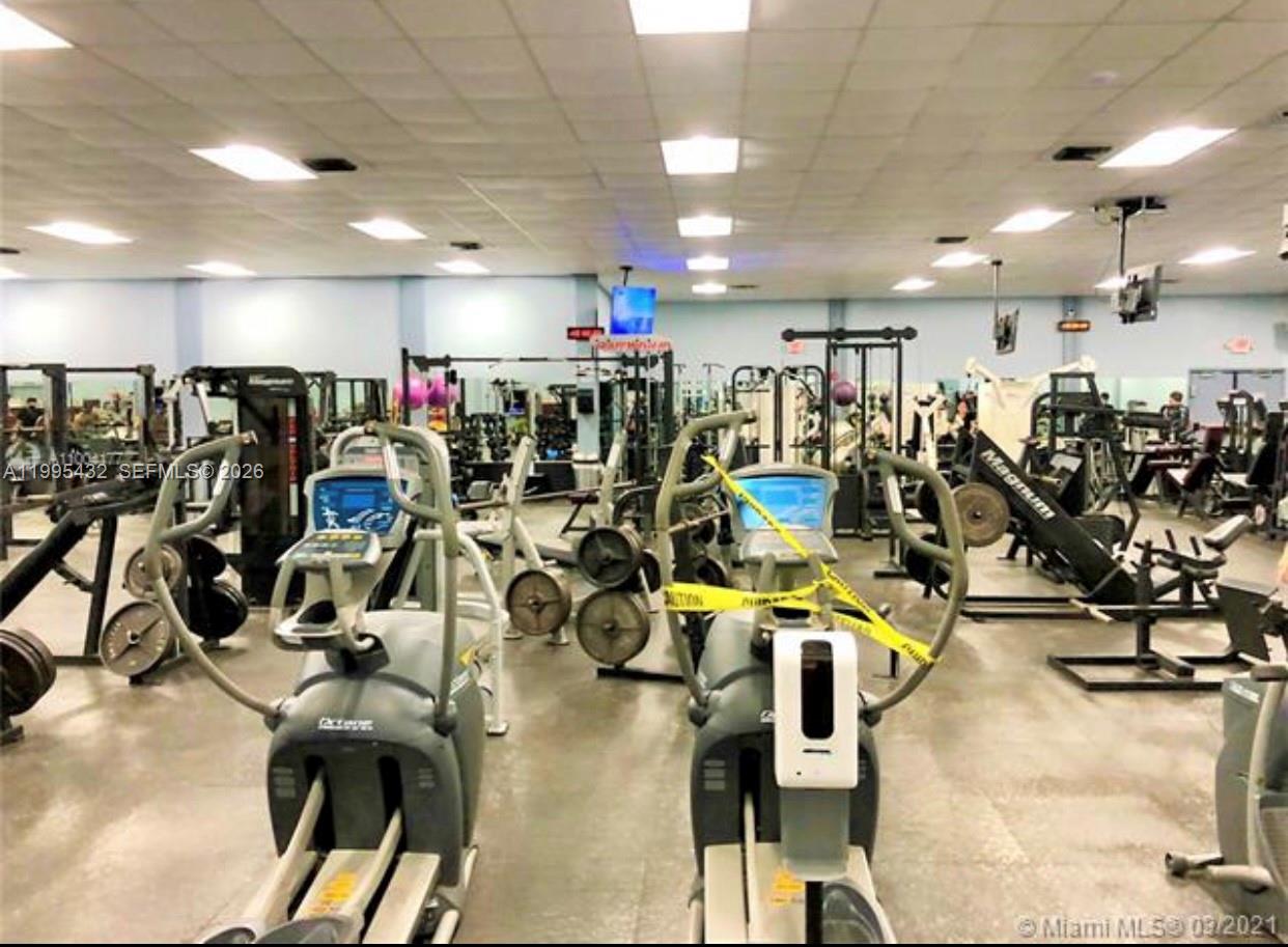 16300 Golf Club Road, Unit 208 Weston, FL 33326 - Photo 23 of 25 a view of a room with gym equipment