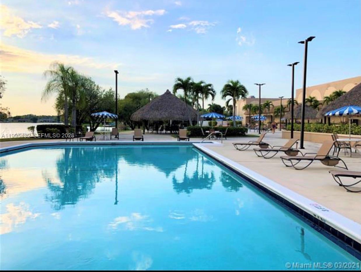 16300 Golf Club Road, Unit 208 Weston, FL 33326 - Photo 24 of 25 a view of swimming pool with chairs