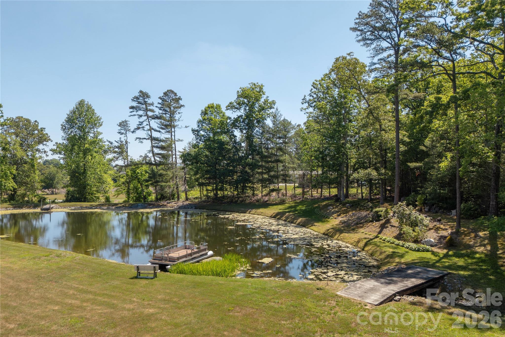 231 Allen Road East Flat Rock, NC 28726 - Photo 36 of 42 a view of a lake with a yard